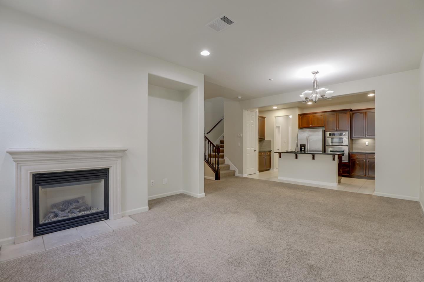 5090 Fioli Loop San Ramon, CA 94582 - Photo 2 of 36 a view of a livingroom with a fireplace and window