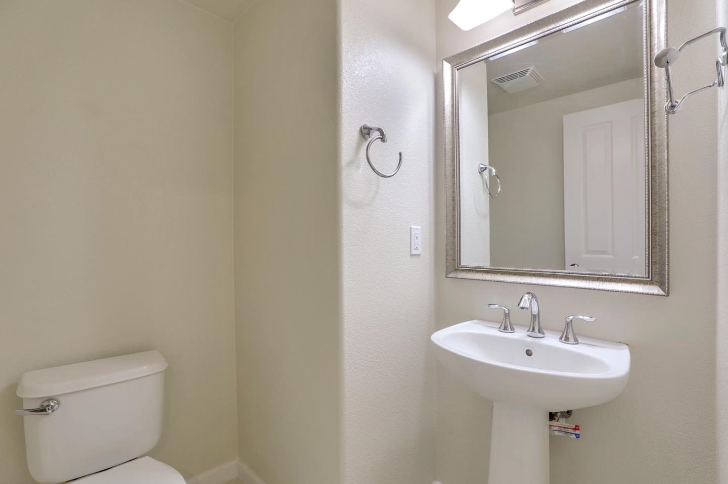 5090 Fioli Loop San Ramon, CA 94582 - Photo 11 of 36 a bathroom with a sink toilet and a mirror