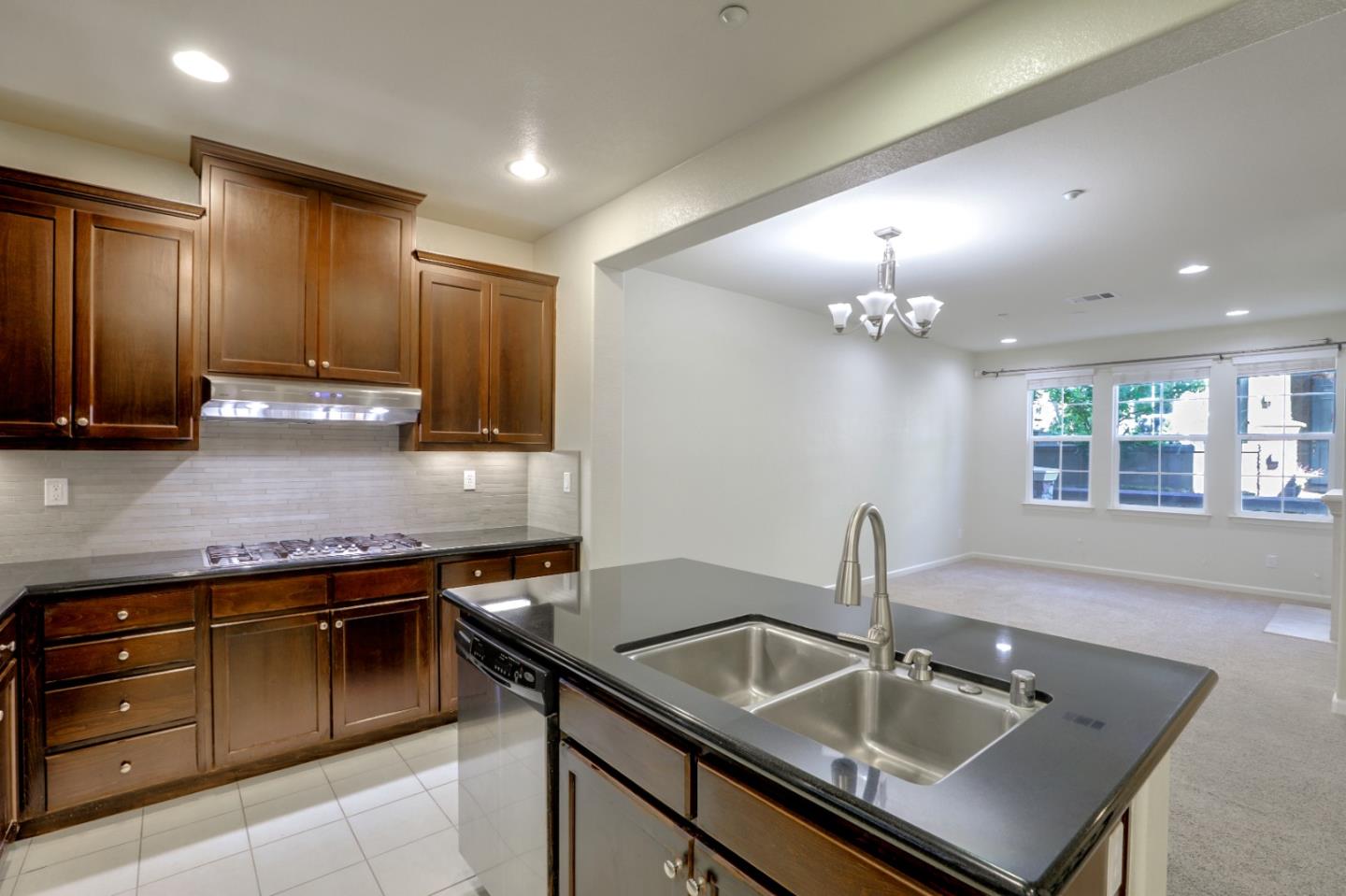 5090 Fioli Loop San Ramon, CA 94582 - Photo 8 of 36 a kitchen that has a sink and a stove in it