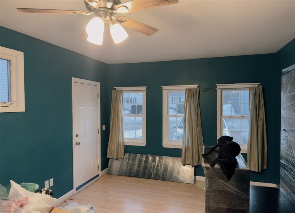 84 Chester Street Worcester, MA 01605 - Photo 11 of 21 a living room with furniture and a large window