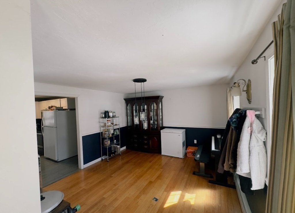 84 Chester Street Worcester, MA 01605 - Photo 6 of 21 a view of a kitchen with fridge and workspace