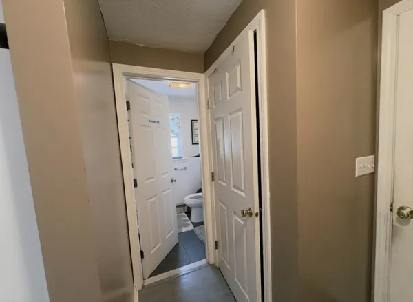a view of a bathroom from a hallway