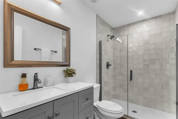 a kitchen with stainless steel appliances granite countertop a refrigerator stove and sink