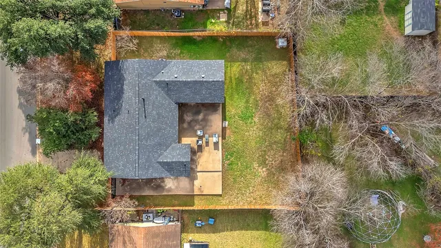 an aerial view of residential house with outdoor space