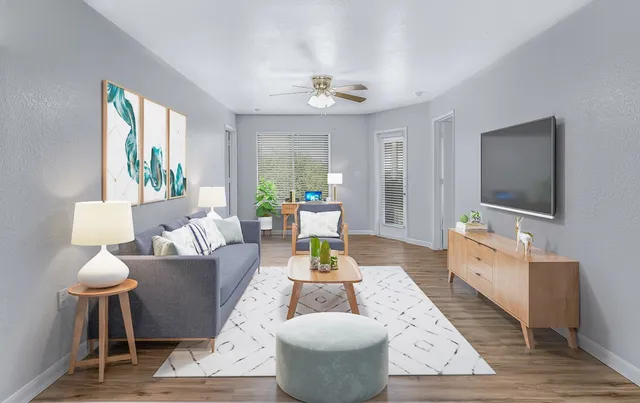 a living room with furniture and a flat screen tv