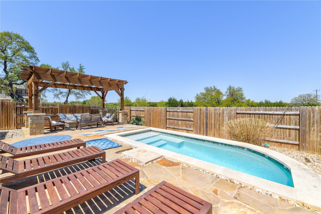 1205 Half Hitch Trail Georgetown, TX 78633 - Photo 1 of 1 a view of a swimming pool with a lounge chair