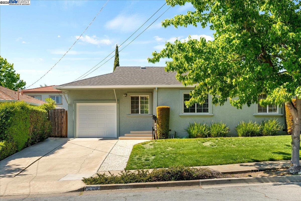 323 De Leon Avenue Fremont, CA 94539 - Photo 1 of 16 a front view of a house with a yard and potted plants