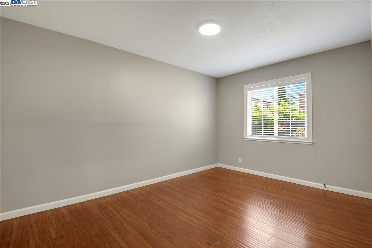 323 De Leon Avenue Fremont, CA 94539 - Photo 11 of 16 wooden floor in an empty room with a window