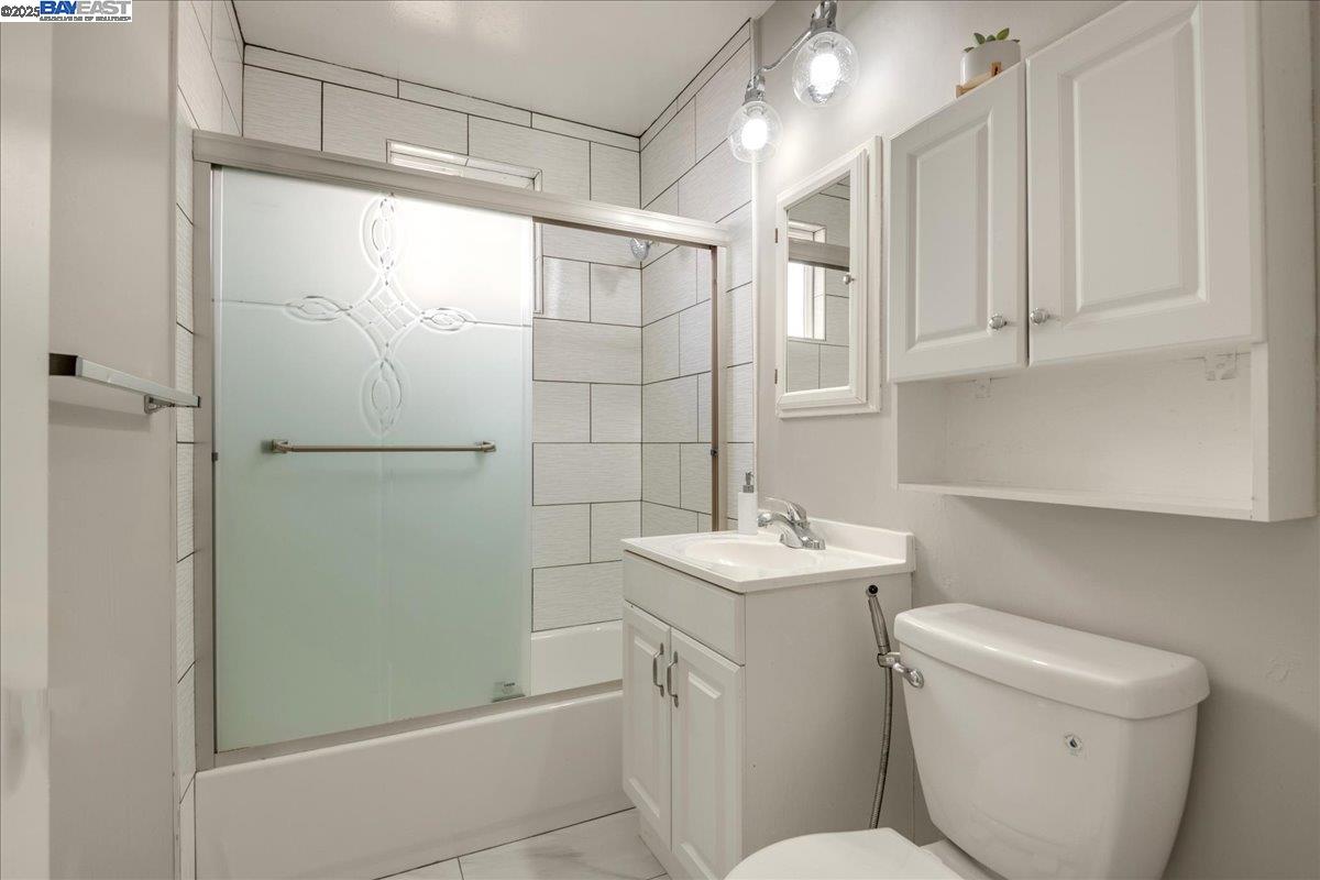 323 De Leon Avenue Fremont, CA 94539 - Photo 13 of 16 a bathroom with a shower toilet and sink