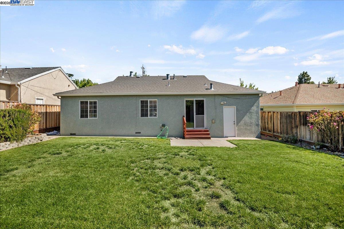 323 De Leon Avenue Fremont, CA 94539 - Photo 3 of 16 a front view of a house with a garden