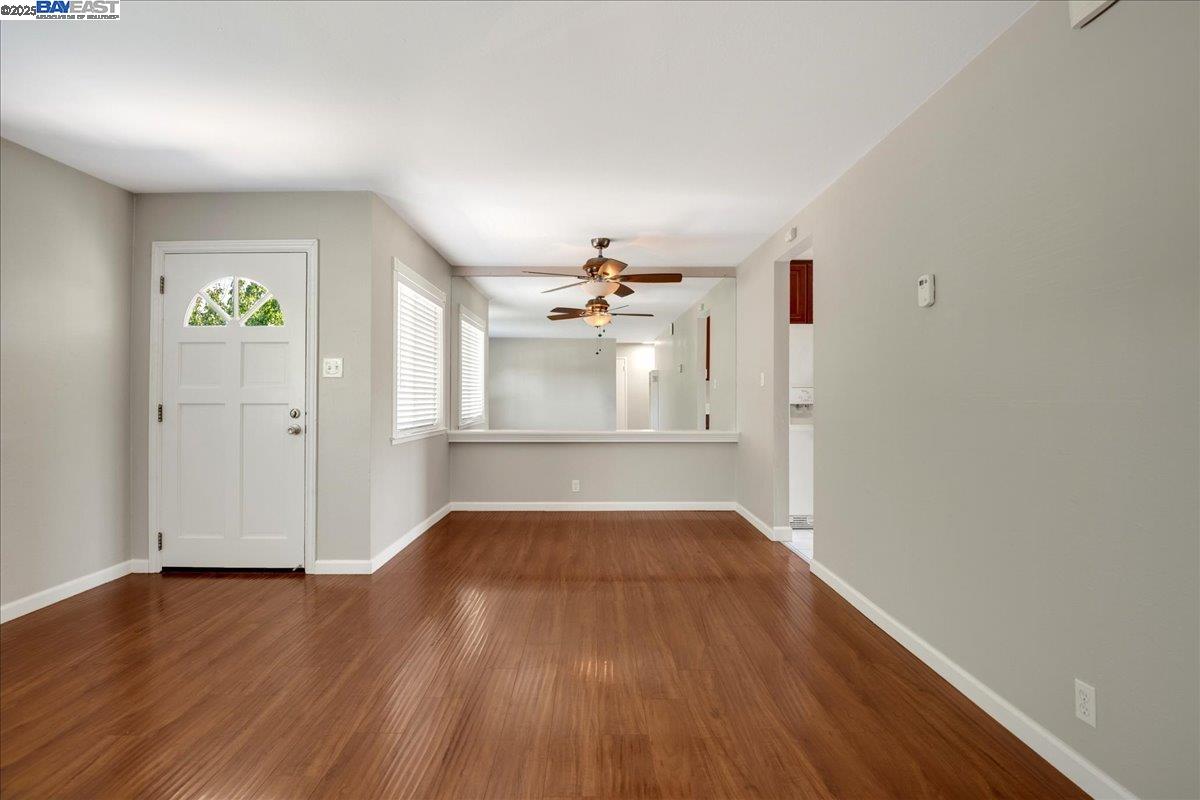 323 De Leon Avenue Fremont, CA 94539 - Photo 4 of 16 wooden floor in an empty room with a window