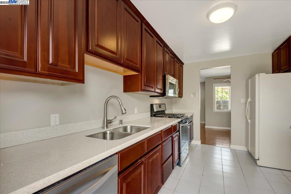 323 De Leon Avenue Fremont, CA 94539 - Photo 8 of 16 a kitchen with a sink cabinets and appliances