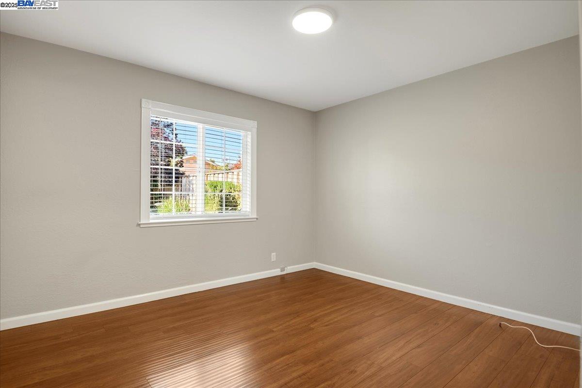 323 De Leon Avenue Fremont, CA 94539 - Photo 10 of 16 wooden floor in an empty room with a window