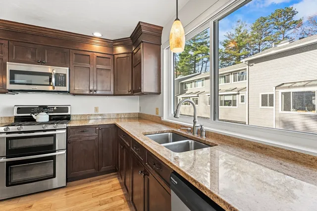 a kitchen that has a sink and a stove