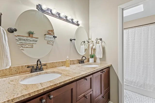 a white bath tub sitting next to a white toilet