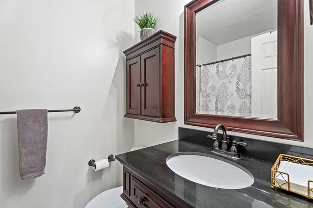 a livingroom with workspace and a couch