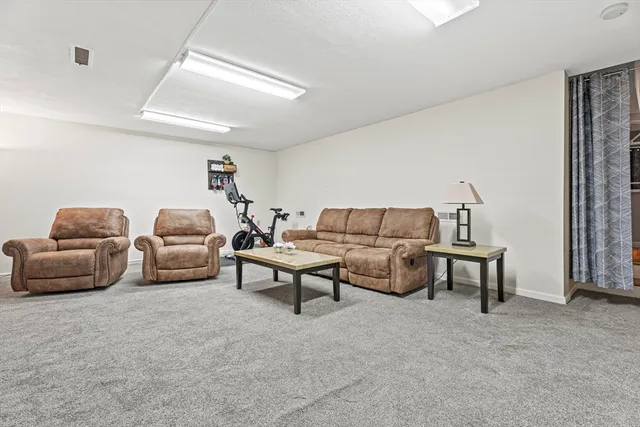 a balcony with furniture and wooden floor