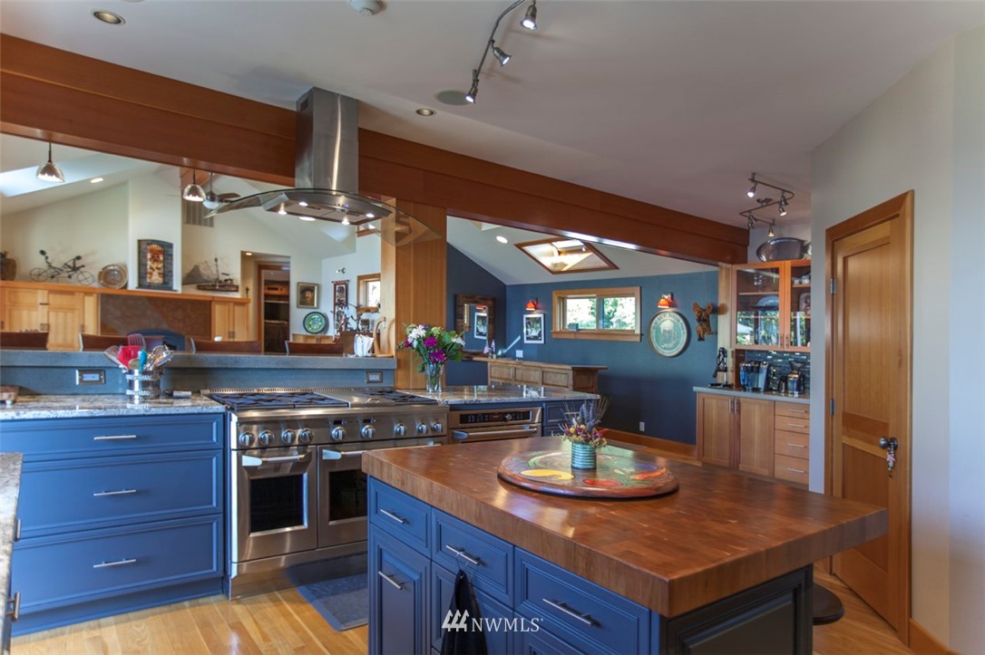 804 Fieldston Road Bellingham, WA 98225 - Photo 13 of 40 a kitchen with stainless steel appliances granite countertop a sink and a stove