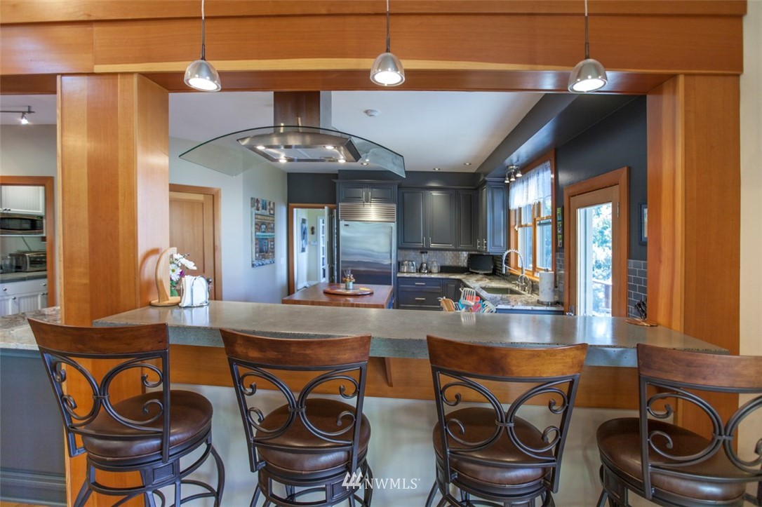 804 Fieldston Road Bellingham, WA 98225 - Photo 16 of 40 a kitchen with stainless steel appliances granite countertop a sink a stove and a refrigerator