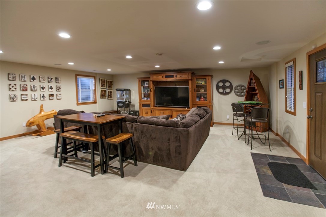 804 Fieldston Road Bellingham, WA 98225 - Photo 20 of 40 a living room with furniture and a flat screen tv