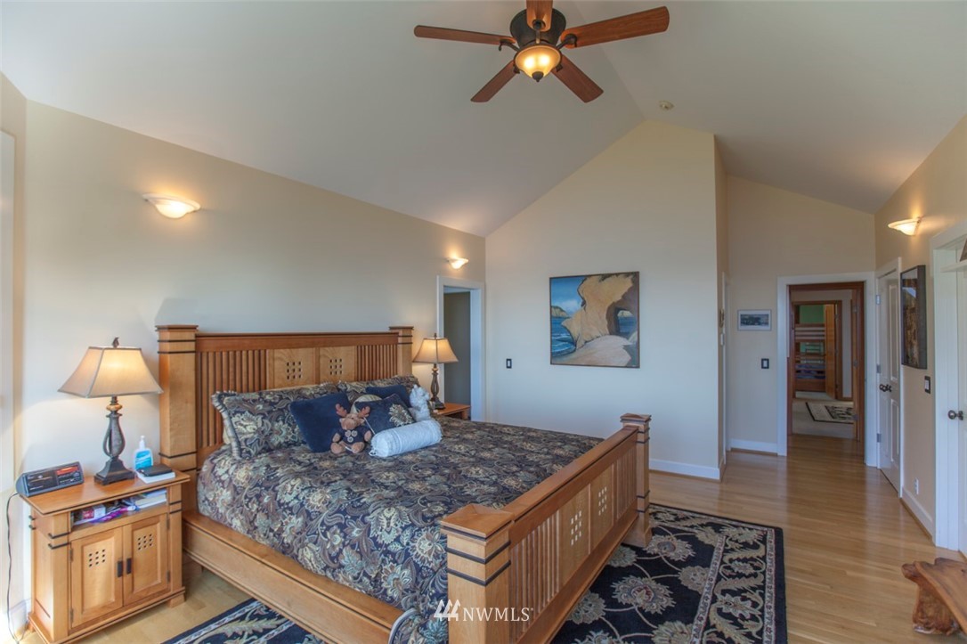 804 Fieldston Road Bellingham, WA 98225 - Photo 25 of 40 a bedroom with a bed and wooden floor