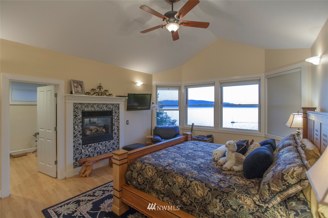 804 Fieldston Road Bellingham, WA 98225 - Photo 27 of 40 a bed room with a bed and a fireplace