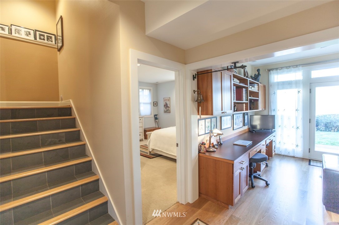 804 Fieldston Road Bellingham, WA 98225 - Photo 33 of 40 a view of a bedroom with wooden floor and windows