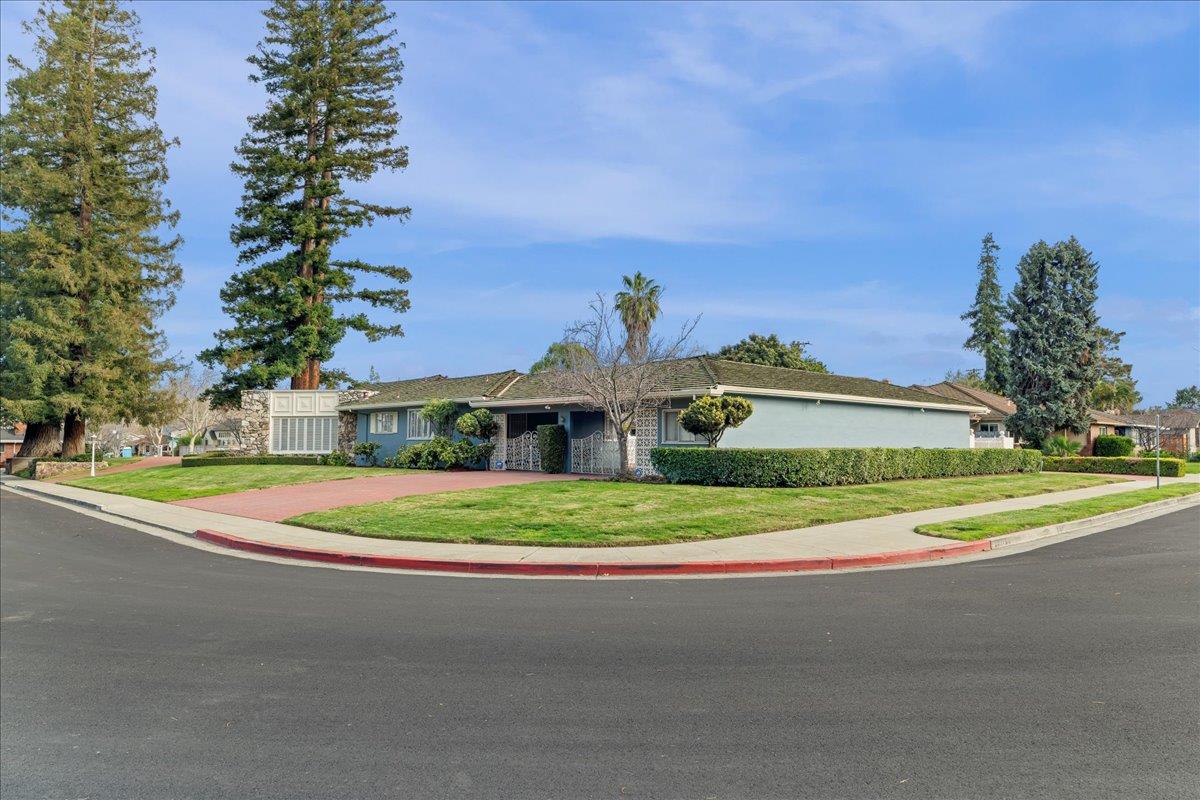 1215 Camino Ramon San Jose, CA 95125 - Photo 12 of 76 a front view of a house with a yard and trees
