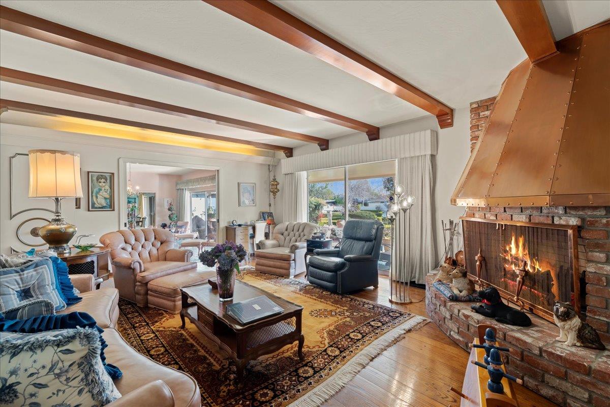 1215 Camino Ramon San Jose, CA 95125 - Photo 32 of 76 a living room with furniture a rug and a large window