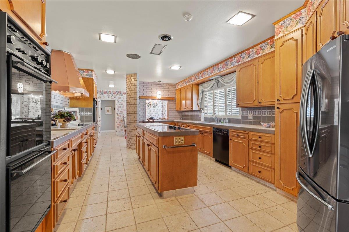 1215 Camino Ramon San Jose, CA 95125 - Photo 34 of 76 a kitchen with stainless steel appliances granite countertop a refrigerator and a stove top oven