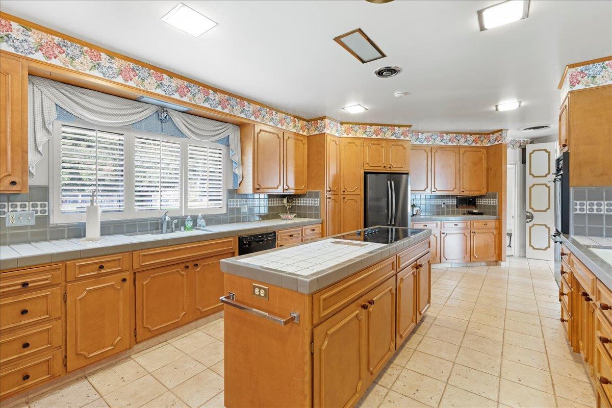 1215 Camino Ramon San Jose, CA 95125 - Photo 36 of 76 a kitchen with stainless steel appliances granite countertop a stove top oven a sink a refrigerator and white cabinets