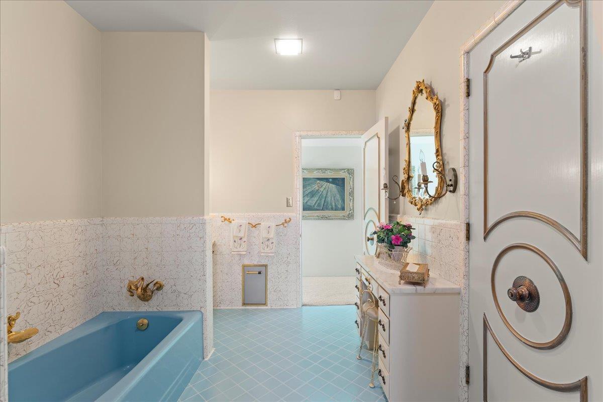 1215 Camino Ramon San Jose, CA 95125 - Photo 44 of 76 a bathroom with a sink a mirror and a bathtub