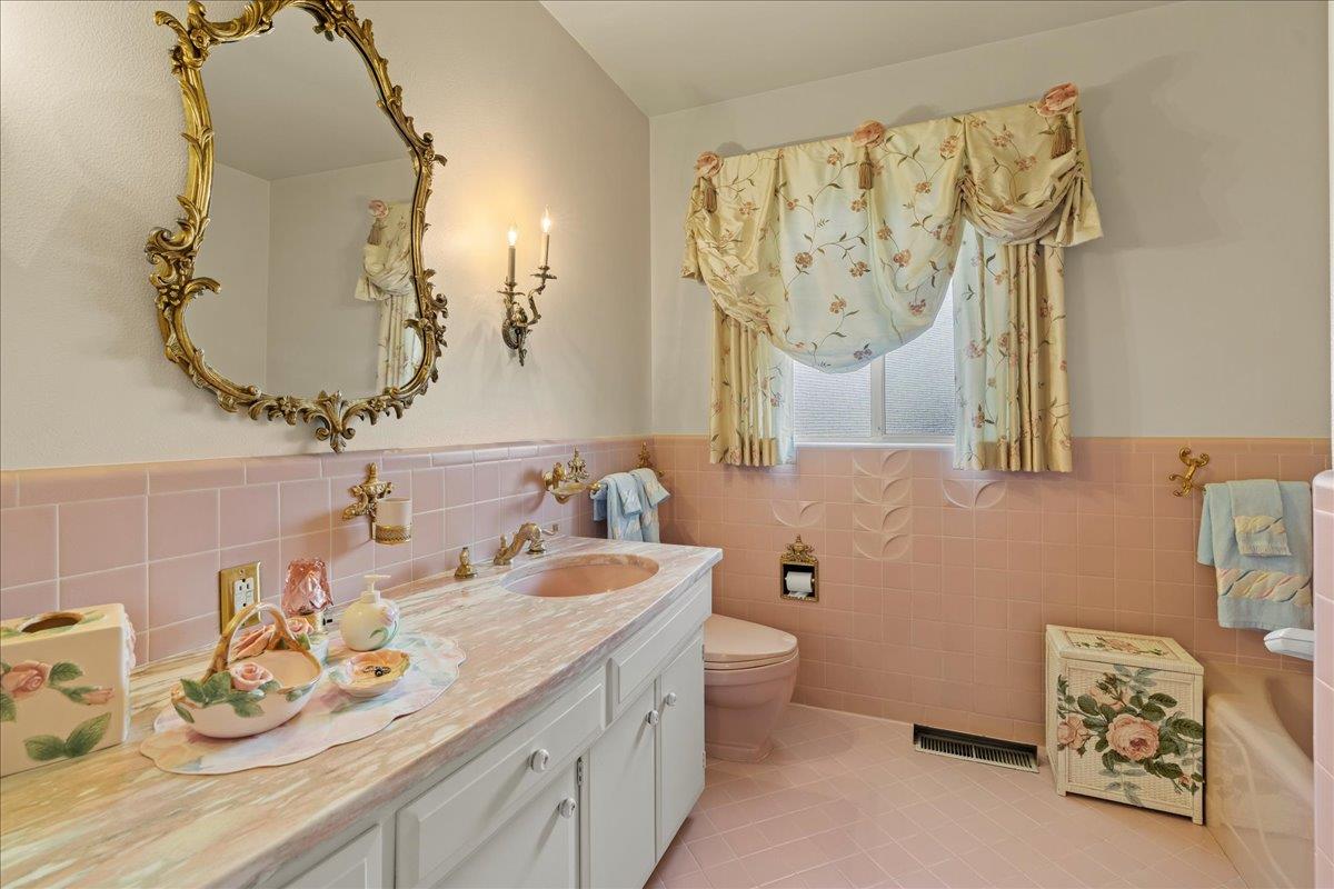 1215 Camino Ramon San Jose, CA 95125 - Photo 50 of 76 a bathroom with a granite countertop sink and a mirror
