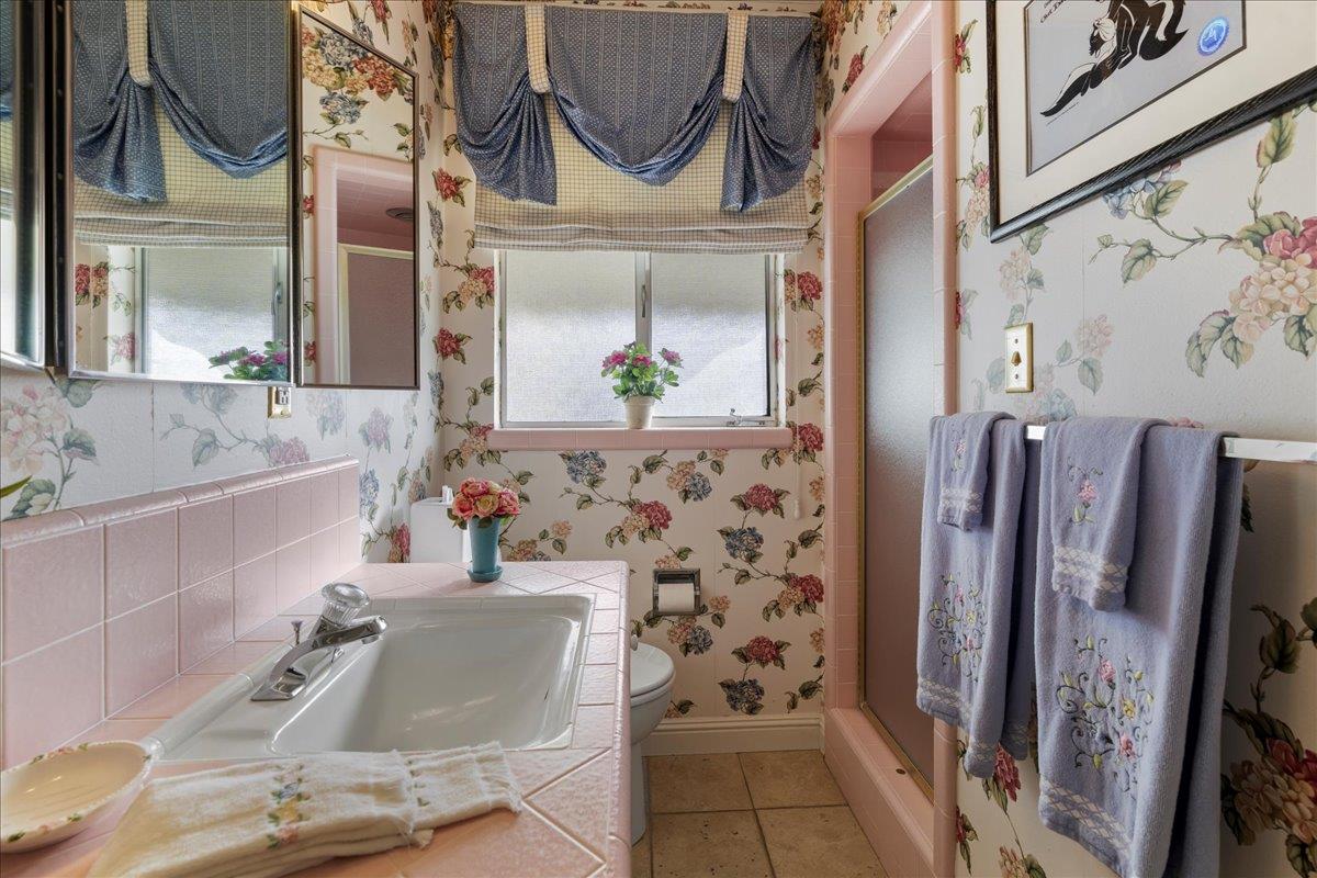 1215 Camino Ramon San Jose, CA 95125 - Photo 51 of 76 a bathroom with a tub sink and mirror