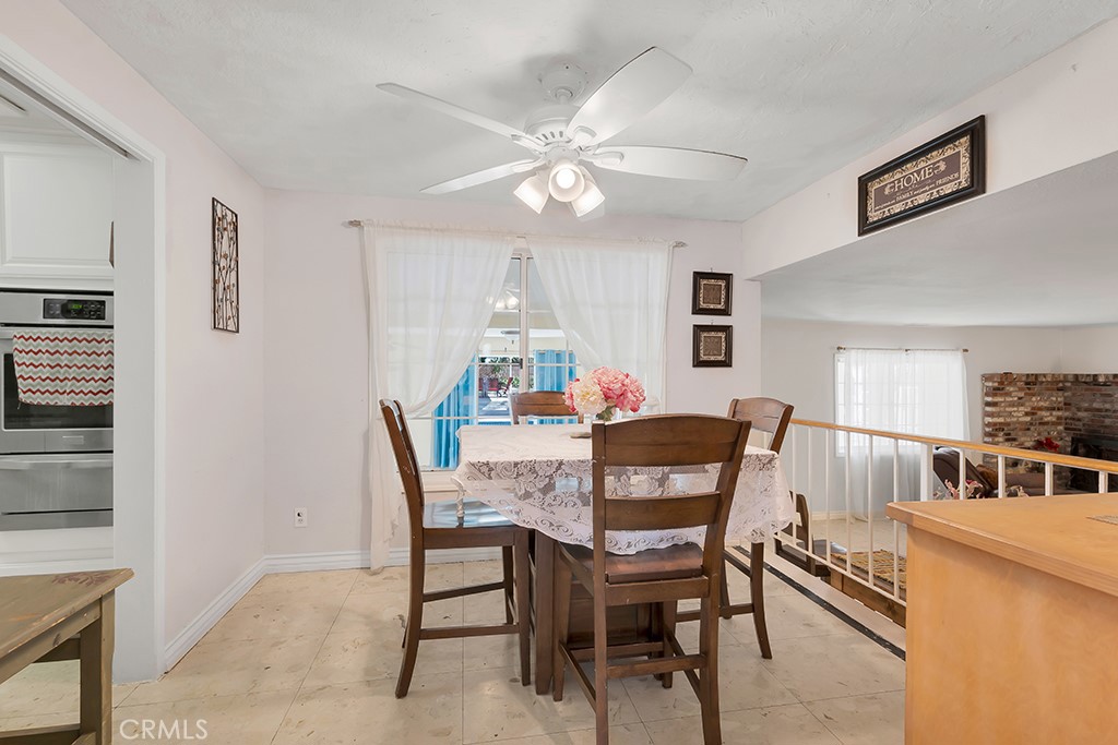14024 Tyler Street Sylmar, CA 91342 - Photo 14 of 50 a dining room with furniture and window
