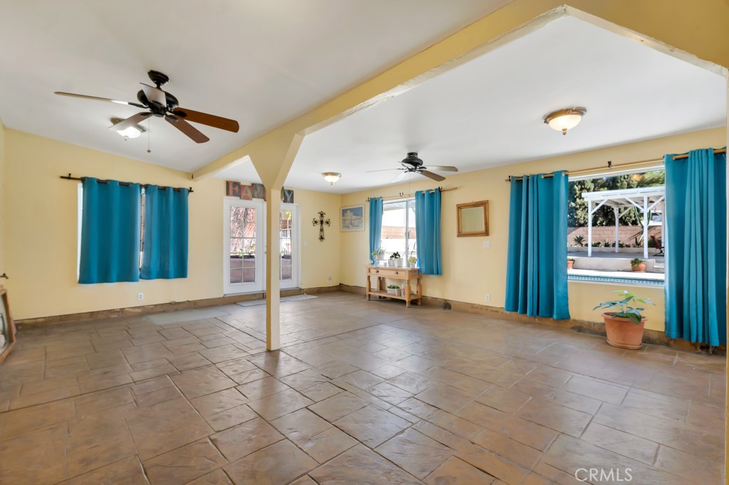 14024 Tyler Street Sylmar, CA 91342 - Photo 20 of 50 a view of a livingroom with furniture and a ceiling fan