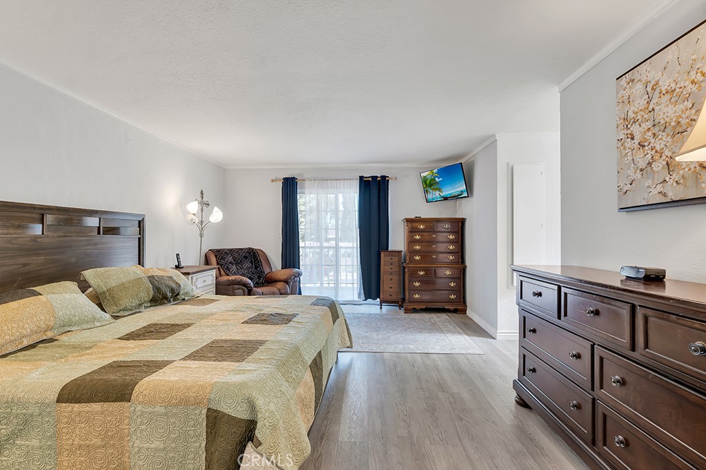 14024 Tyler Street Sylmar, CA 91342 - Photo 22 of 50 a bedroom with a bed and a television