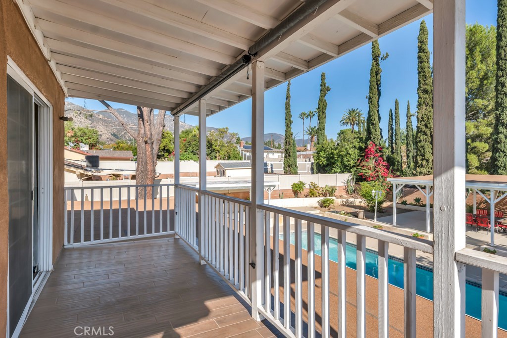 14024 Tyler Street Sylmar, CA 91342 - Photo 28 of 50 a view of a porch with wooden floor