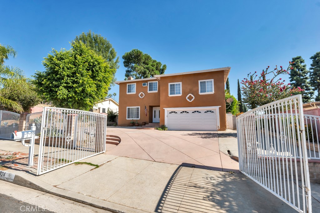 14024 Tyler Street Sylmar, CA 91342 - Photo 3 of 50 a view of a house with wooden fence
