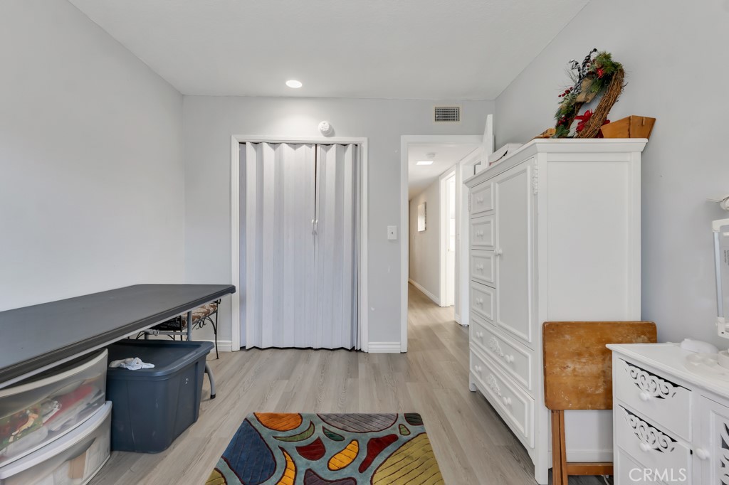 14024 Tyler Street Sylmar, CA 91342 - Photo 33 of 50 a kitchen with stainless steel appliances granite countertop a refrigerator and a stove top oven