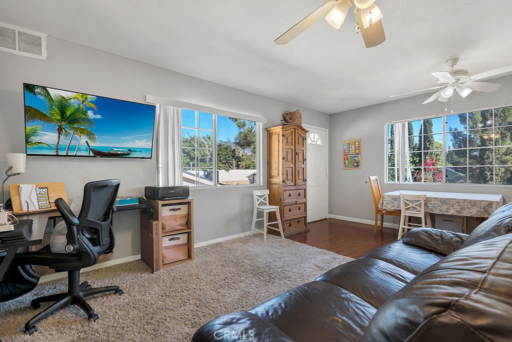 14024 Tyler Street Sylmar, CA 91342 - Photo 36 of 50 a workspace with furniture and a window