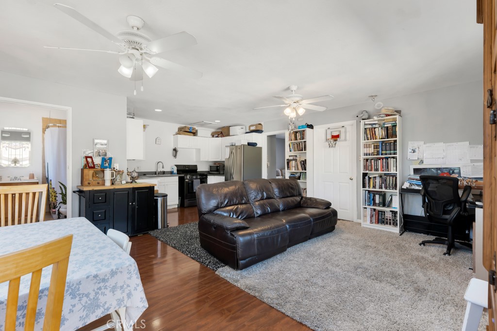 14024 Tyler Street Sylmar, CA 91342 - Photo 37 of 50 a living room with furniture and a flat screen tv