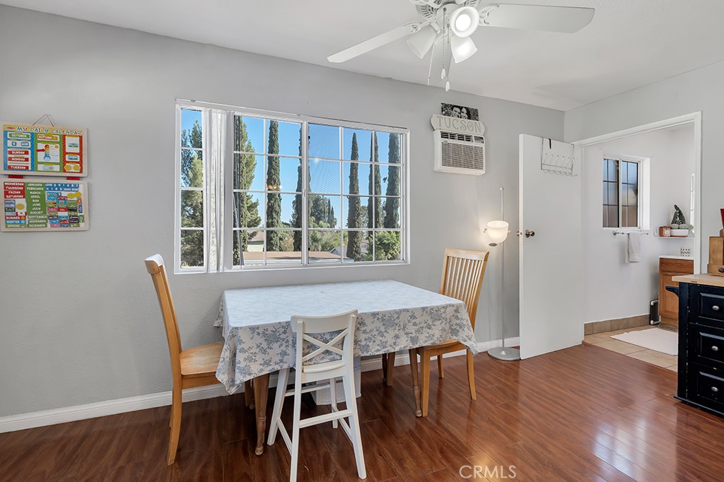 14024 Tyler Street Sylmar, CA 91342 - Photo 39 of 50 a view of a dining room with furniture window and wooden floor