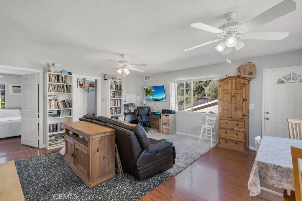 14024 Tyler Street Sylmar, CA 91342 - Photo 40 of 50 a living room with furniture and a flat screen tv