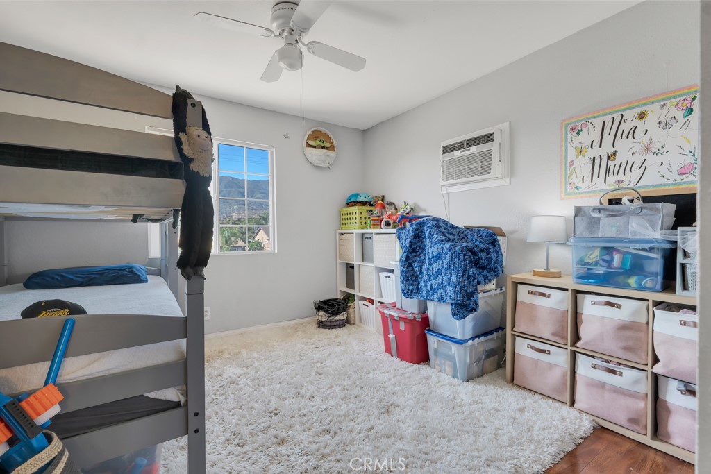 14024 Tyler Street Sylmar, CA 91342 - Photo 42 of 50 a bed room with furniture and a lamp