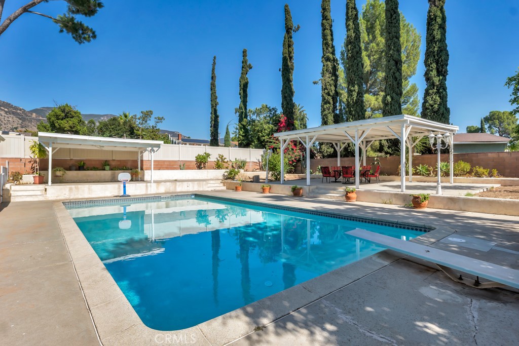 14024 Tyler Street Sylmar, CA 91342 - Photo 6 of 50 a view of a swimming pool with outdoor seating