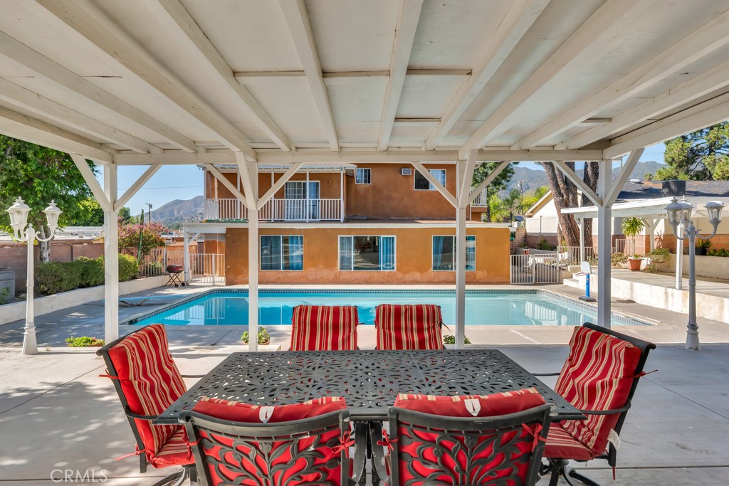 14024 Tyler Street Sylmar, CA 91342 - Photo 9 of 50 a view of a patio with a table and chairs