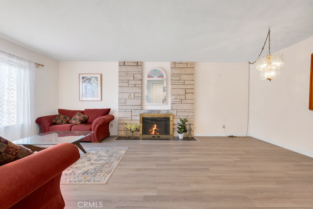 14024 Tyler Street Sylmar, CA 91342 - Photo 10 of 50 a living room with furniture and a fireplace