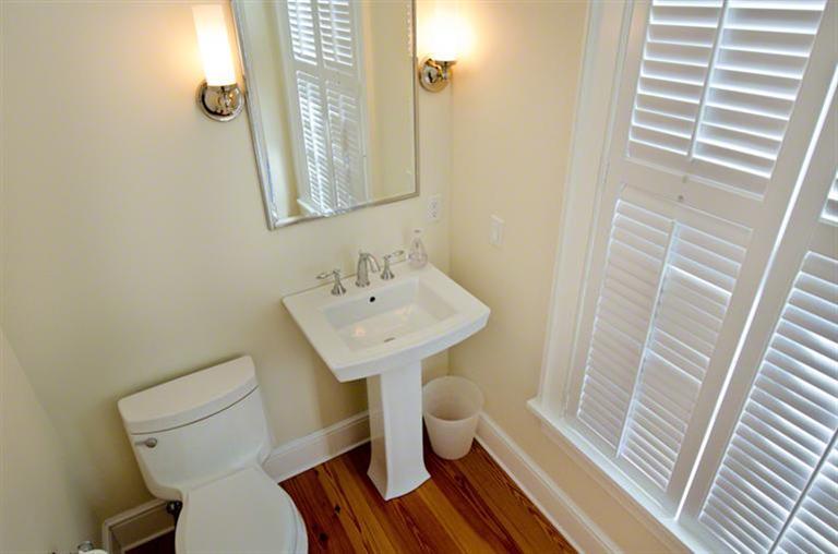 4 Magnolia Way Edgartown, MA 02539 - Photo 12 of 23 a bathroom with a sink a toilet a mirror and shower
