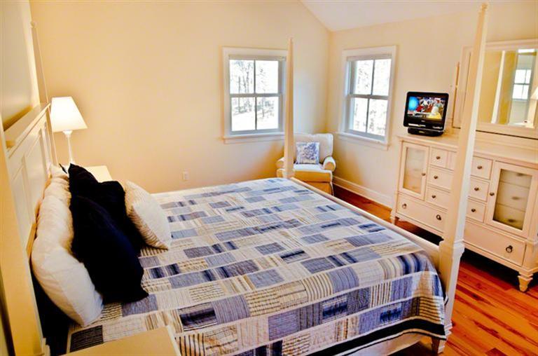 4 Magnolia Way Edgartown, MA 02539 - Photo 14 of 23 a bedroom with a bed and window